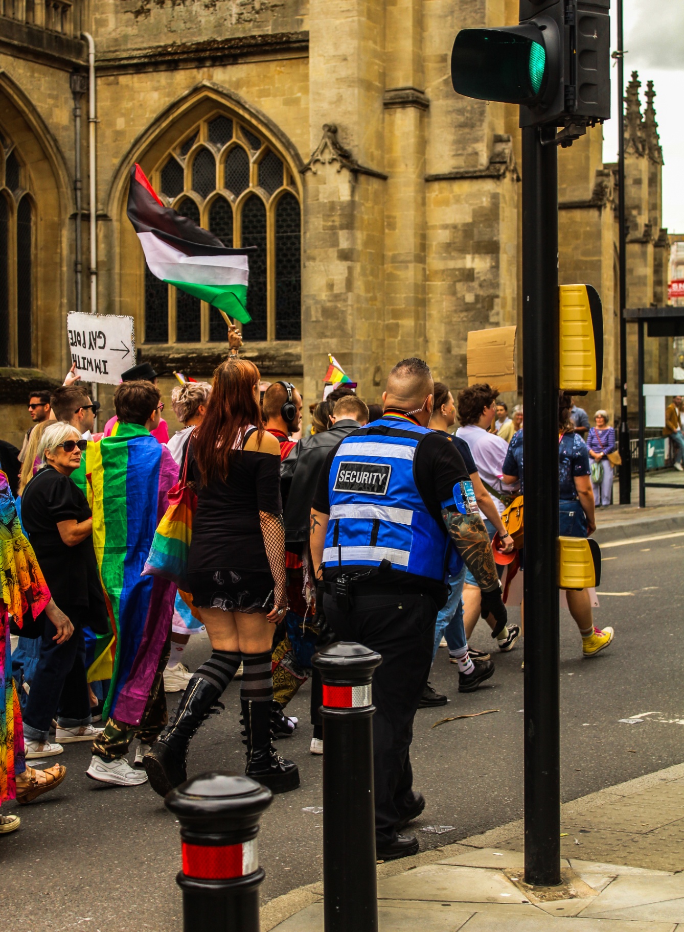Security officer managing a road closure at the Bath Pride parade