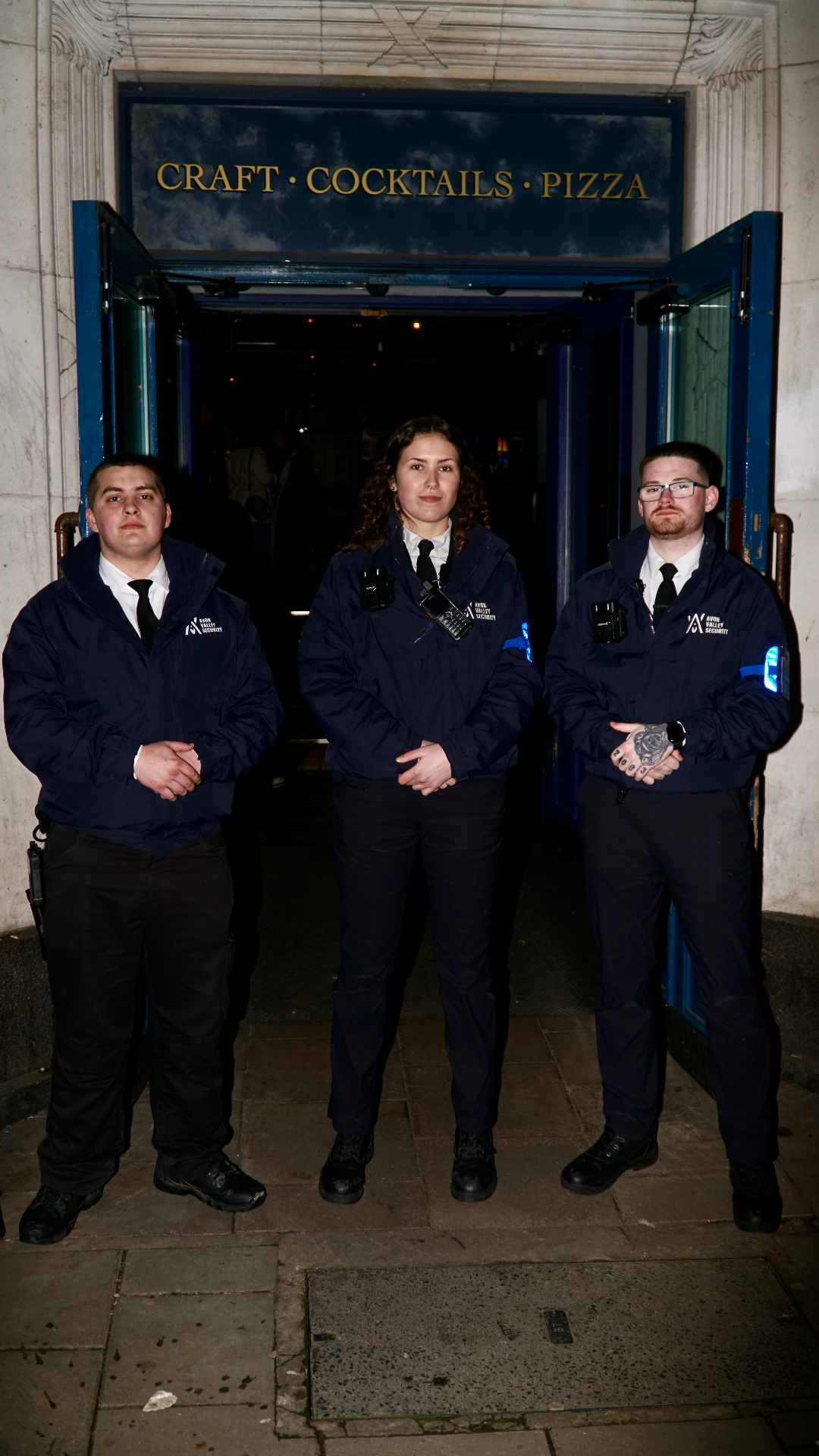Venue security team stationed at the entrance of a Bristol cocktail bar and pizzeria