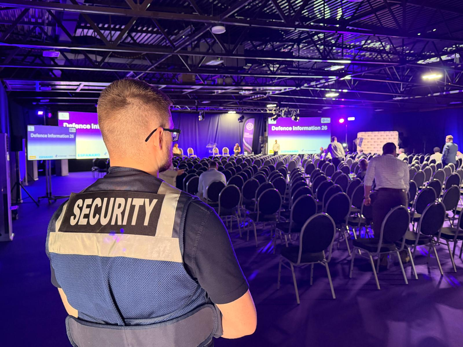 AV Group UK security officer overseeing delegates at a conference in Bristol